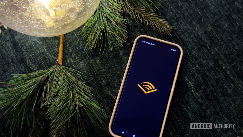 A Google Pixel 9 displays an Amazon Audible logo.