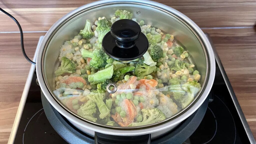 A rice cooker full of veggies