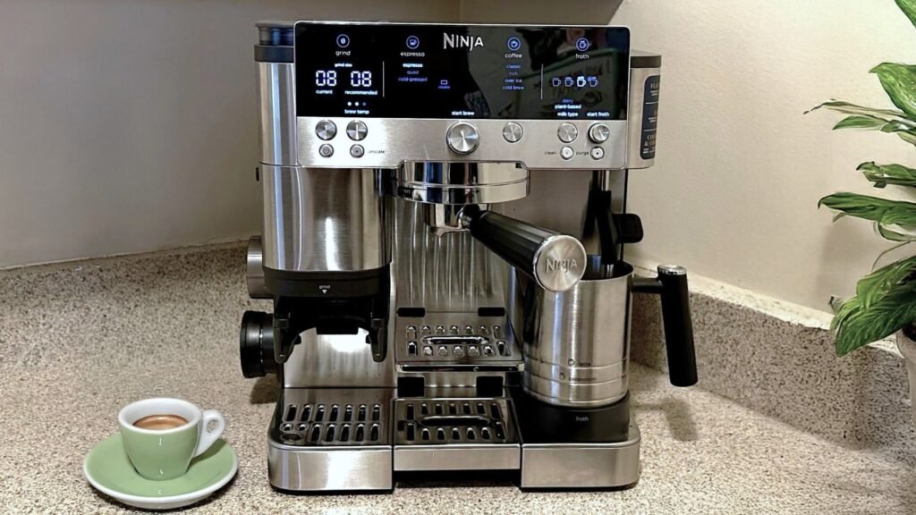 Ninja Luxe Caf&eacute; coffee maker on klitchen counter with potted plant and espresso cup