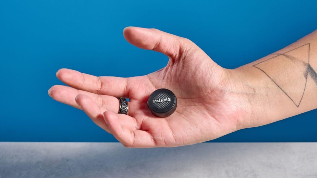 Insta360 Mic Air photographed on a blue background