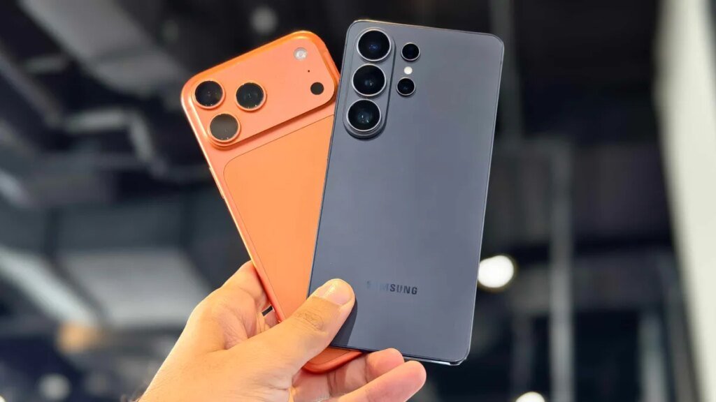 Samsung’s Galaxy S26 Telephones Will Work With Apple’s AirDrop, A lot Just like the Pixel 10 Prakhar holding the iPhone 17 Pro Max and Galaxy S26 Ultra.