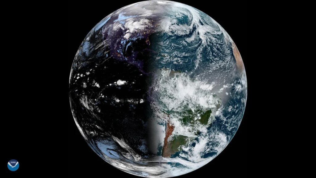 Satellite view of Earth during vernal equinox showing planet half shadowed.