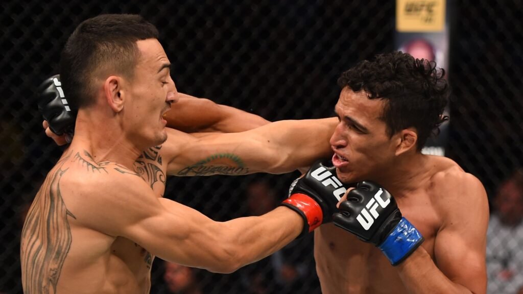 There’s a sneaky way to watch UFC 326 for $1 UFC fighters Charles Oliveira and Max Holloway throwing punches at each other