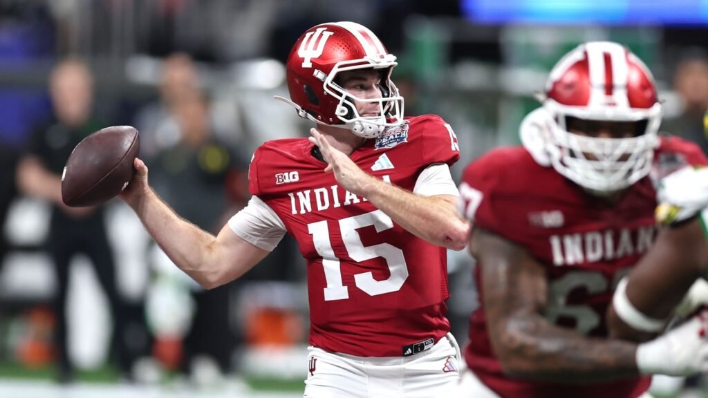 Fernando Mendoza of the Indiana Hoosiers attempts a pass during a College Football Playoff game.