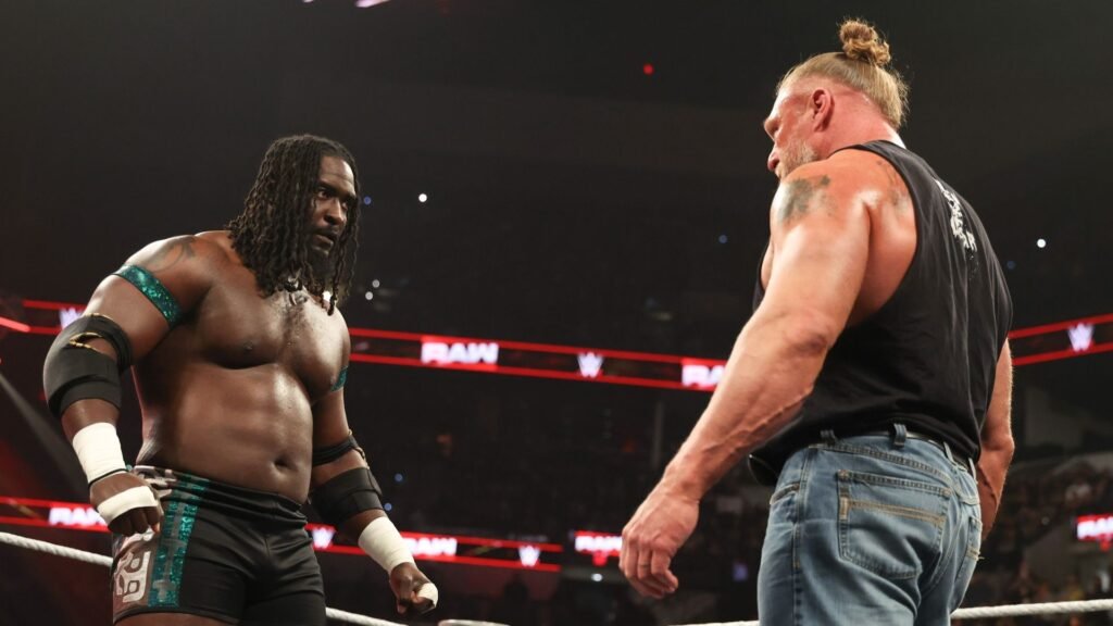 Oba Femi and Brock Lesnar facing off in ring ahead of WrestleMania 42
