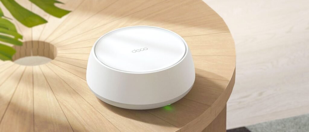 TP-Link Deco BE23 mesh router on a side table
