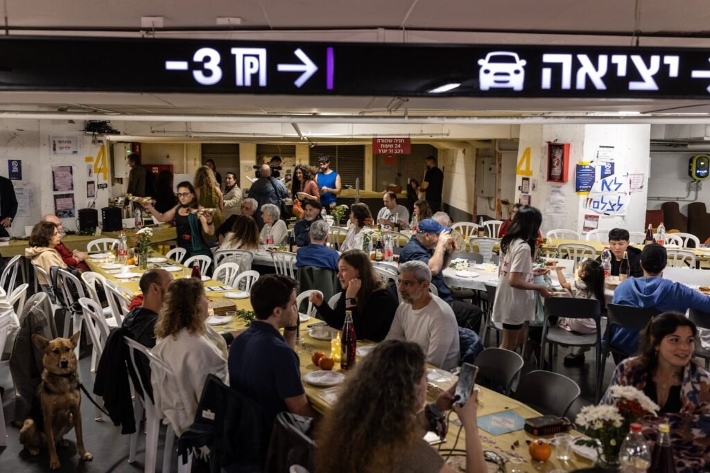 Israelis celebrate Passover in a parking garage turned bomb shelter