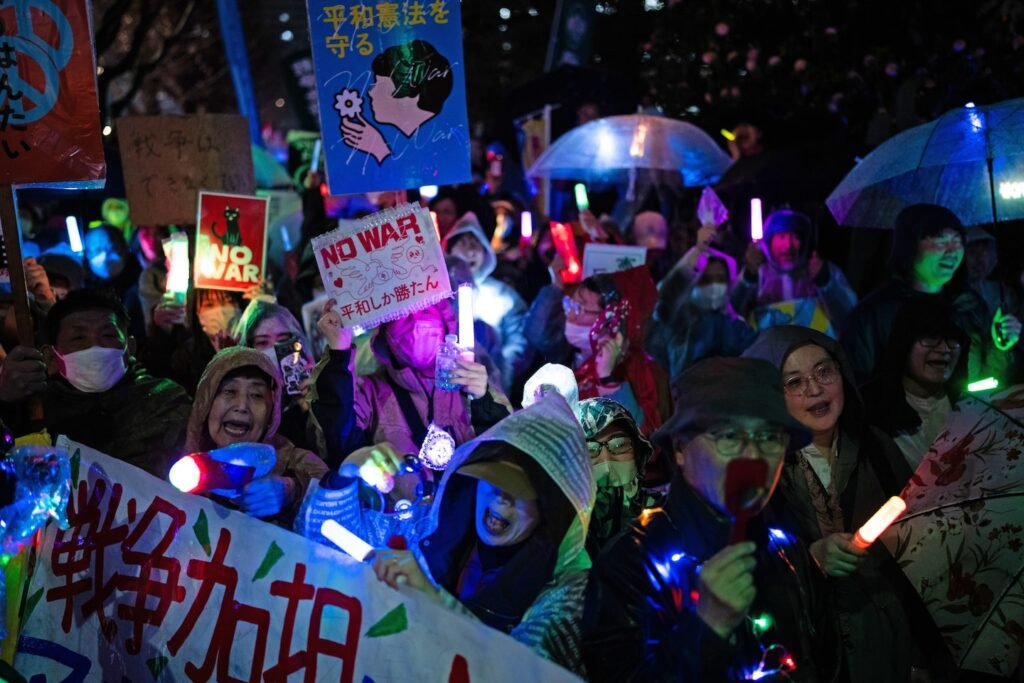 Japan is a pacifist nation. A hint of change is drawing rare protests.
