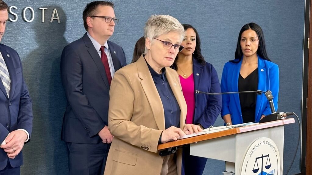 Minnesota charges federal officer with assault for pointing gun at vehicle during immigration surge : NPR