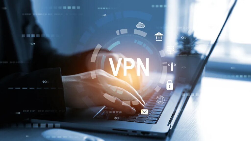 Person sitting at computer with VPN graphic logo shown