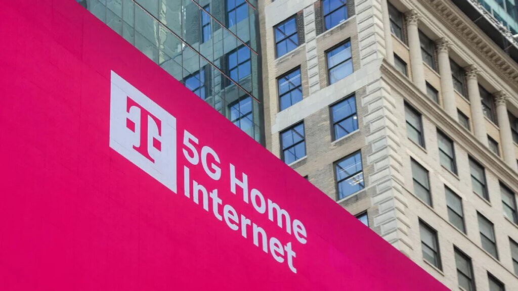 A magenta sign showing T-mobile's logo and 5G home internet in white letters.