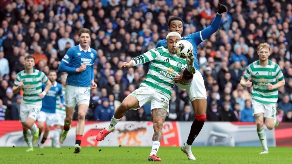 Youssef Chermiti of Rangers takes the ball past Julian Araujo of Celtic in a Scottish Premiership game