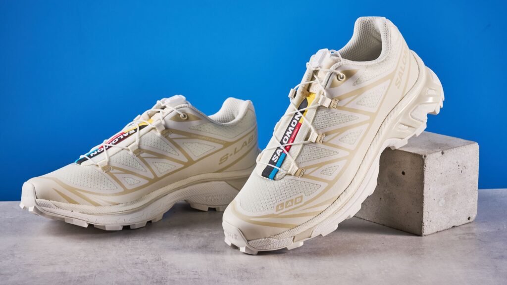 Salomon XT-6 in Vanilla Ice photographed in front of a blue background