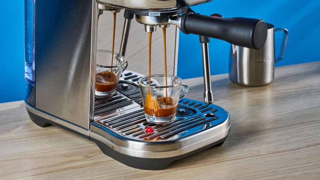 the breville bambino plus in stainless steel silver photographed against a blue background shown with its accessories including milk jug, tamper, portafilter, and shown in use extracting espresso
