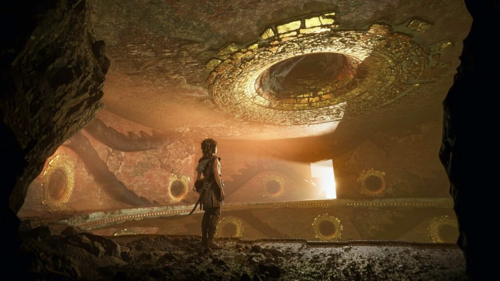 Resonance: A Plague Tale Legacy's main character, Sophia, standing inside an ancient cave.