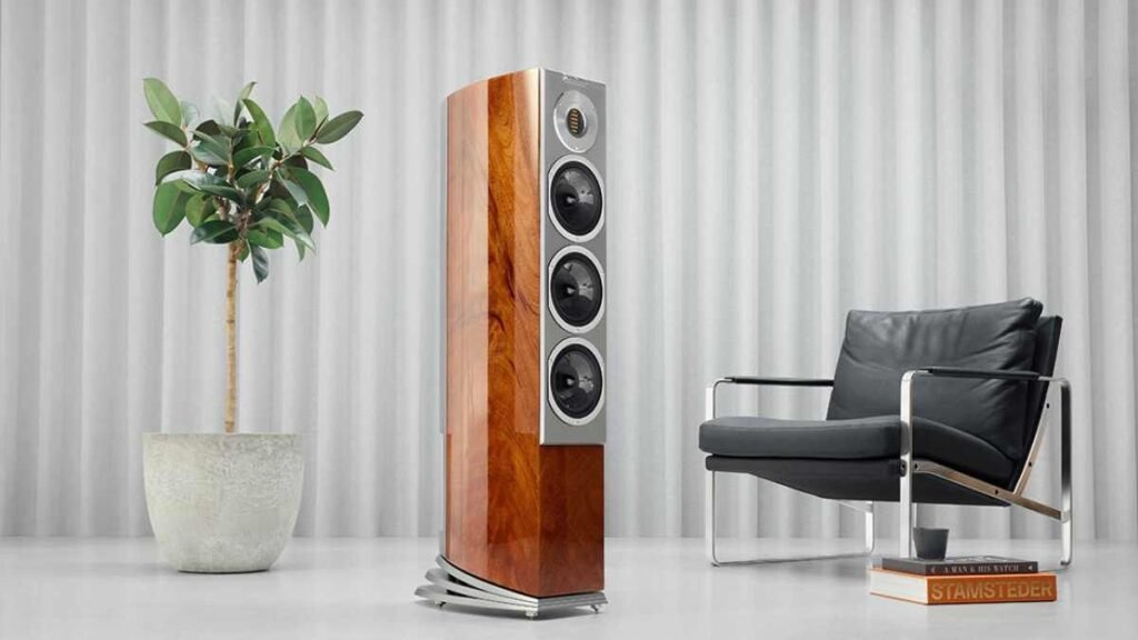 The AudioVector R 5 Arrete next to a chair and a plant.